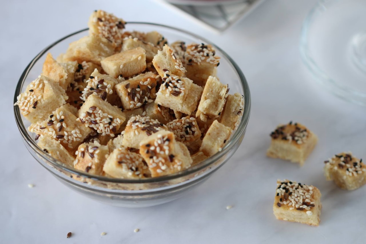 Parmesan cheese bites made by Renana are in a bowl.