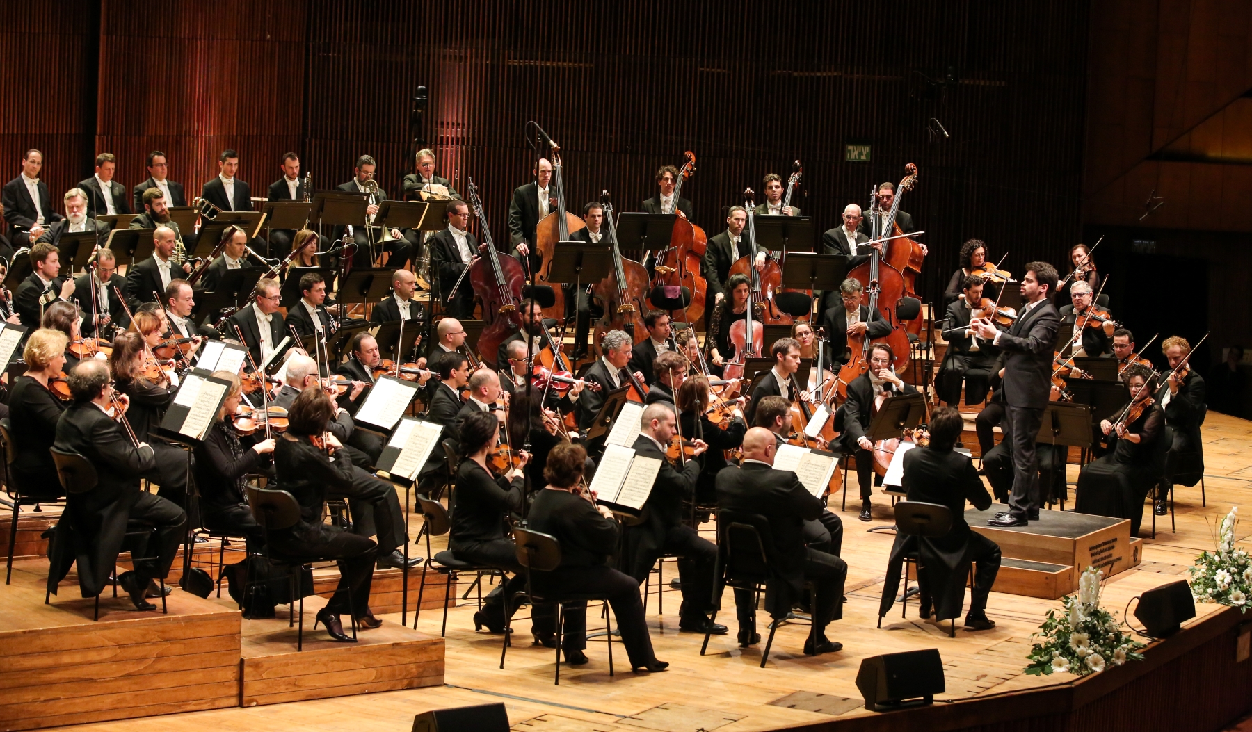 Musicians of Israel Philharmonic Orchestra on a stage during some concert.