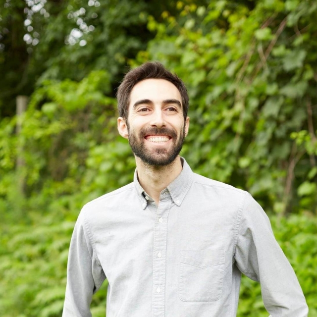 Jeffrey Yoskowitz. Brunette smiling, he wears elegant shirt.