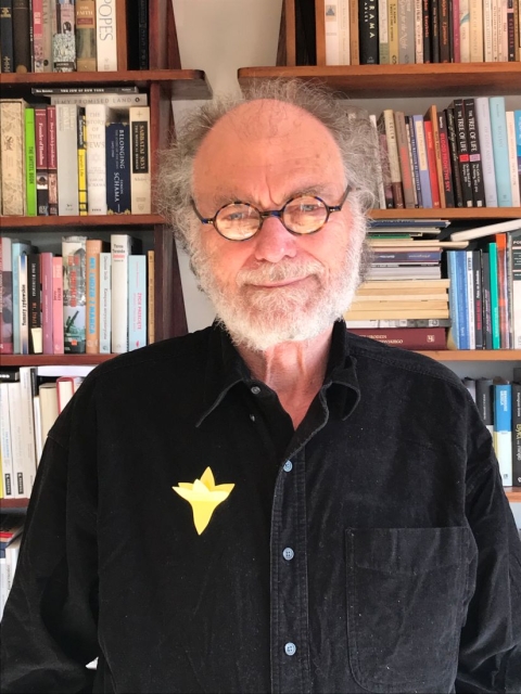 Jerzy Warman in black shirt with yellow paper daffodill 