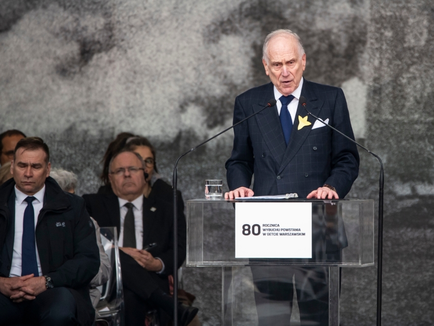 A man  stands at the rostrum during the 80th anniversary of the Warsaw Ghetto Uprising.