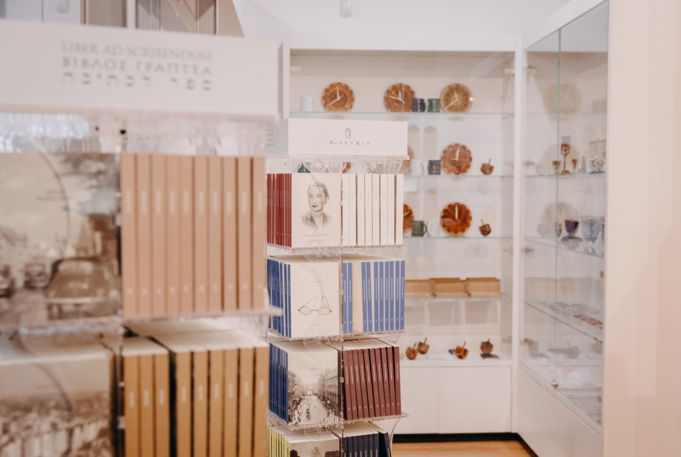 Inside the Austeria shop at POLIN – books neatly arranged on shelves.