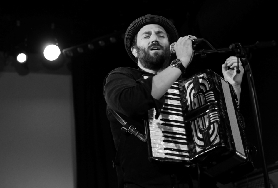 Daniel Kahn plays the accordion.