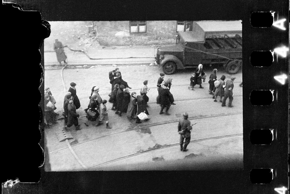 Polish firefighter Zbigniew Grzywaczewski photographs Jews being led away during the Uprising, April 1943