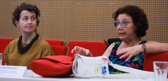 Two women sitting next to each other during 2024 GEOP workshop.