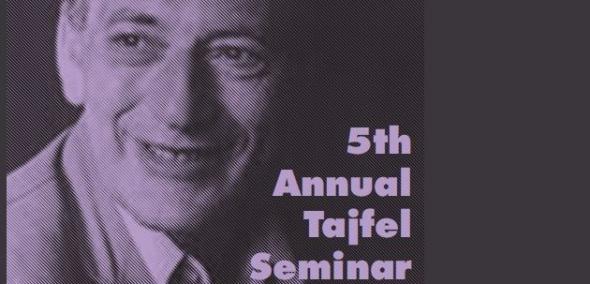 Zdjęcie portretowe mężczyzny, na nim napis po angielsku 5th Annual Tajfel Seminar.